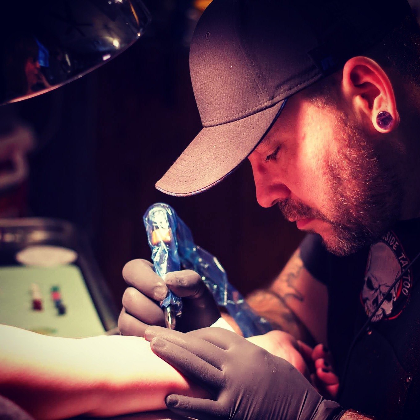 Illustrated Alex tattooing