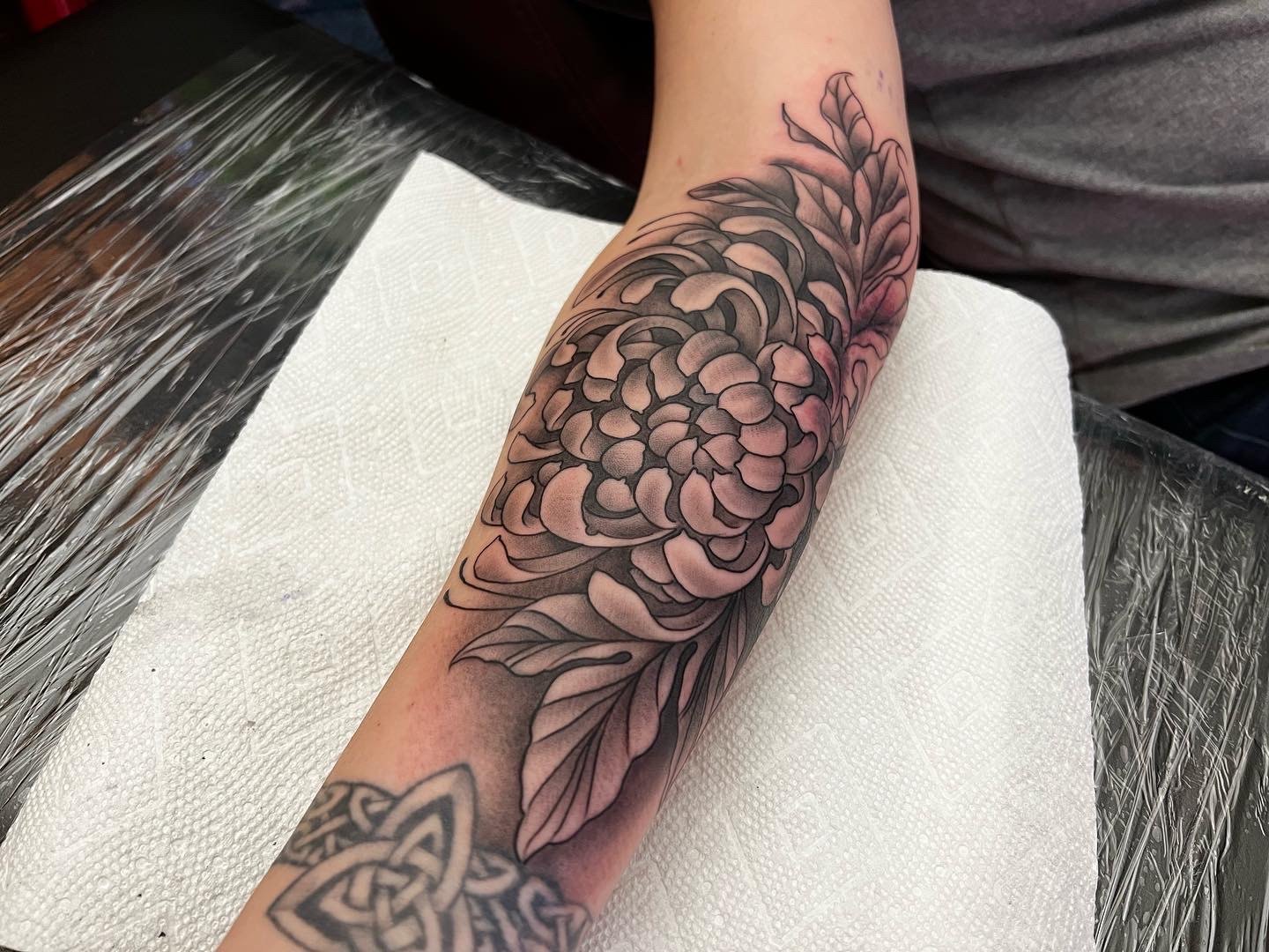 Chrysanthemum forearm tattoo